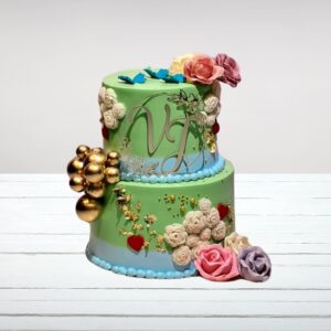 Beautifully decorated Elegant Engagement Cake 4 Kg with elegant gold and white accents, adorned with fresh flowers.