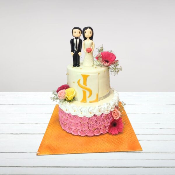 Elegant Fancy Couple Wedding Cake 4 Kg adorned with intricate lace-like patterns and a stylized bride and groom topper.