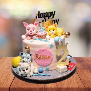 Adorable Happy Kittens Birthday Cake 1 Kg decorated with playful kitten faces and colorful paw prints.