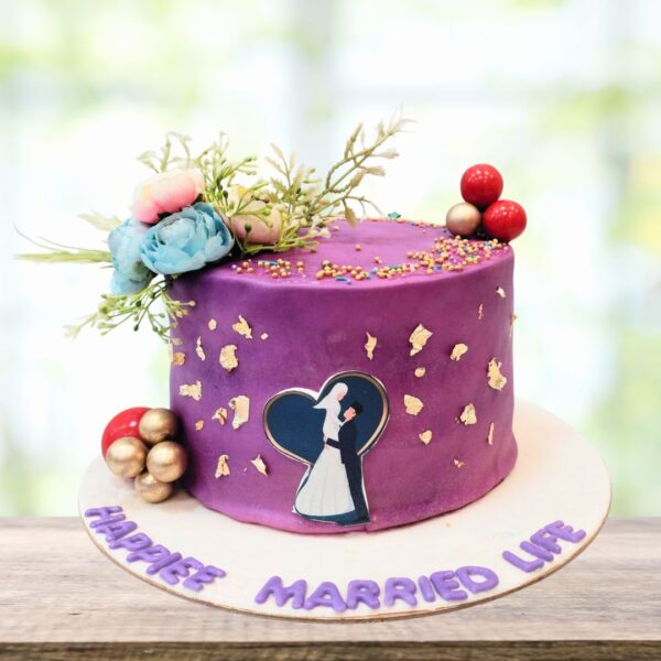 Cake Square's Love Couple 2Kg Engagement Cake featuring fondant couple topper and elegant floral decorations