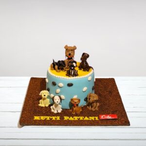 Charming Puppies Theme 2 Kg Birthday Cake decorated with playful puppy faces and paw print accents.