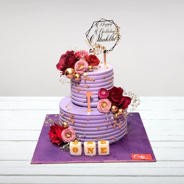 Elegant, multi-tiered wedding cake featuring a stunning purple color scheme in Purple Theme Wedding Cake 4 Kg with delicate floral accents.