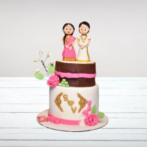 Classic white wedding cake adorned in a Traditional Couple Wedding Cake 3 Kg with bride and groom figurine topper.