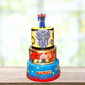 Transformers theme birthday cake 5 Kg with Autobot symbol and metallic decorations