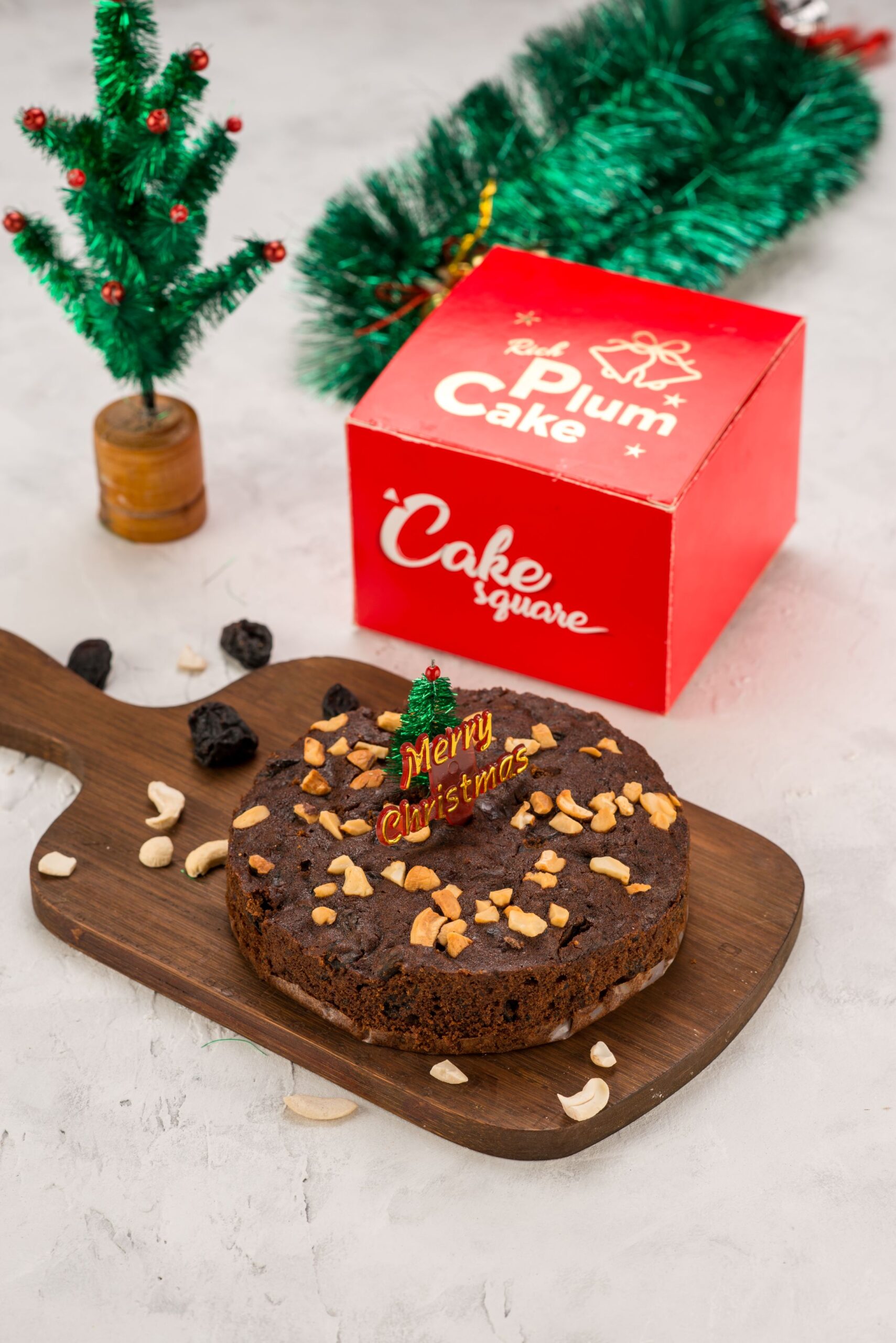 "Festive Christmas Plum Cake 250 gms from Cake Square Chennai, featuring a rich, dark cake filled with spice-soaked fruits and nuts, perfect for holiday celebrations"