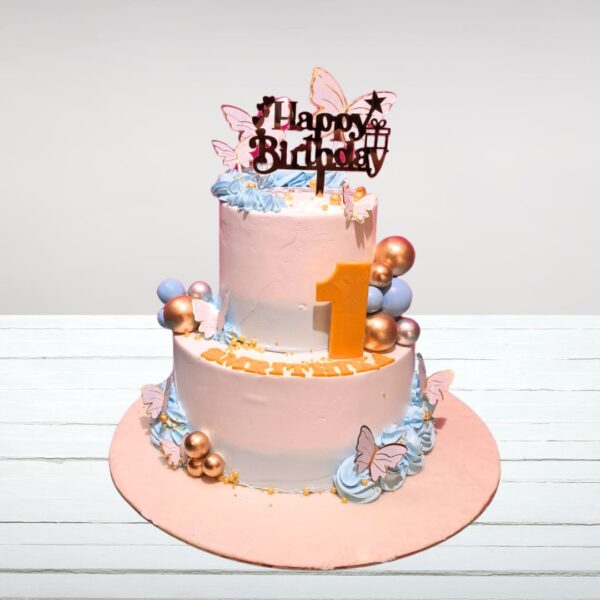 Elegant 4 kg First Birthday cake with pastel colors and gold accents